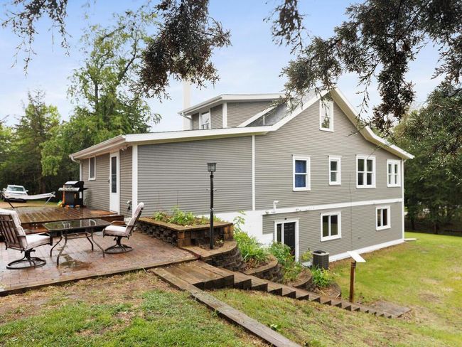 The other side of the home with another entrance. Convenient stairs to get you to the lower section of the yard | Image 8