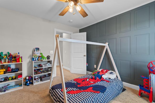 Carpeted bedroom with ceiling fan and baseboards | Image 25