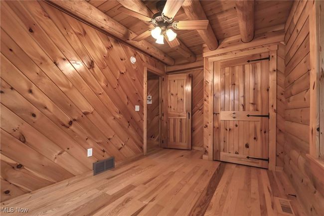 View of first floor bedroom toward closet and exit | Image 13