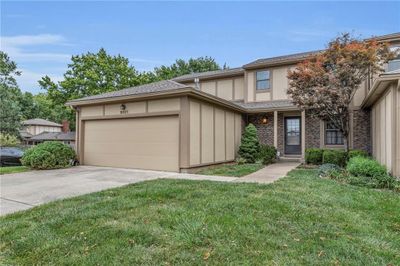 View of front of house featuring a front yard and a garage | Image 2