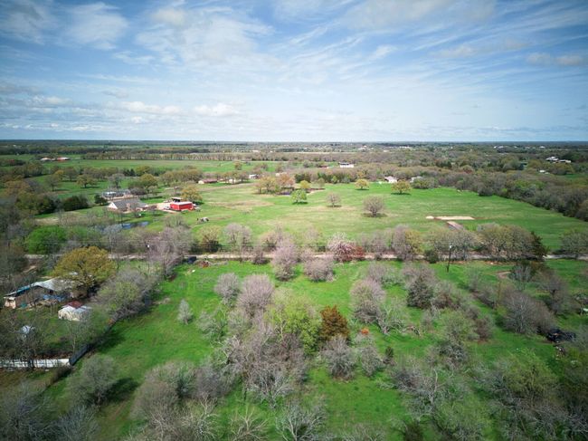 Other view that shows the Co Rd and the neighbors house on the left. | Image 25