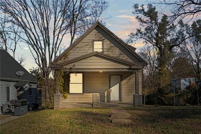 Bungalow-style home featuring a lawn | Image 2