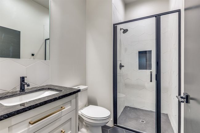 Full bath with vanity and a stall shower | Image 9