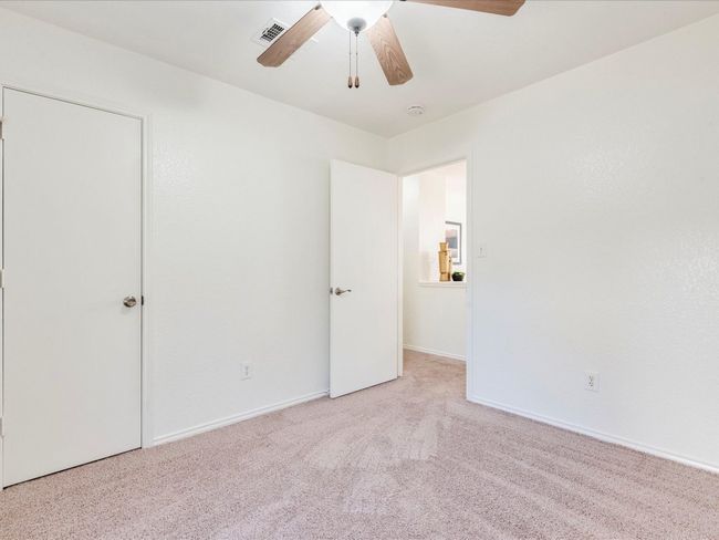 All of the bedrooms boast cozy carpeting and excellent closet storage. | Image 20