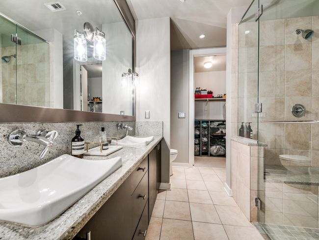 Bathroom featuring toilet, a stall shower, tile patterned floors, a spacious closet, and recessed lighting | Image 8