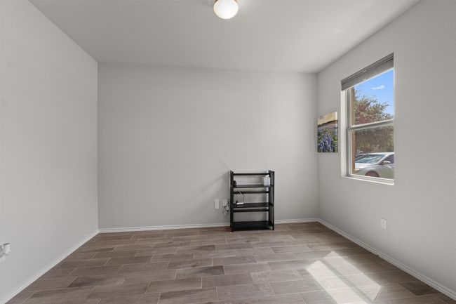 Enjoy privacy in the dedicated office located at the front of the home with a street view. | Image 14