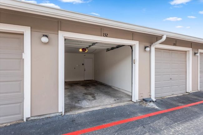 Private garage with alley access and interior stairs to unit | Image 22