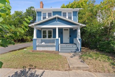 View of front of property with a front yard and a porch | Image 1