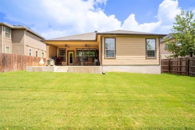 Back of house featuring a ceiling fan, a fenced backyard, and a patio | Image 29