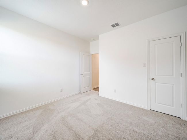 Unfurnished bedroom featuring carpet floors and baseboards | Image 25