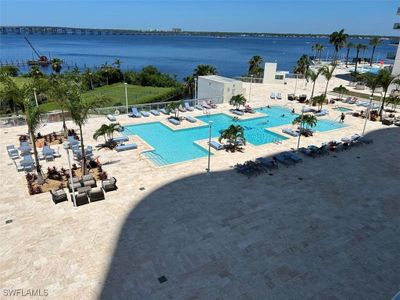 View of swimming pool featuring a water view and a patio area | Image 3