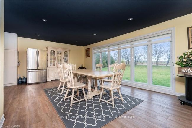 Dining area featuring hardwood / wood-style floors | Image 9