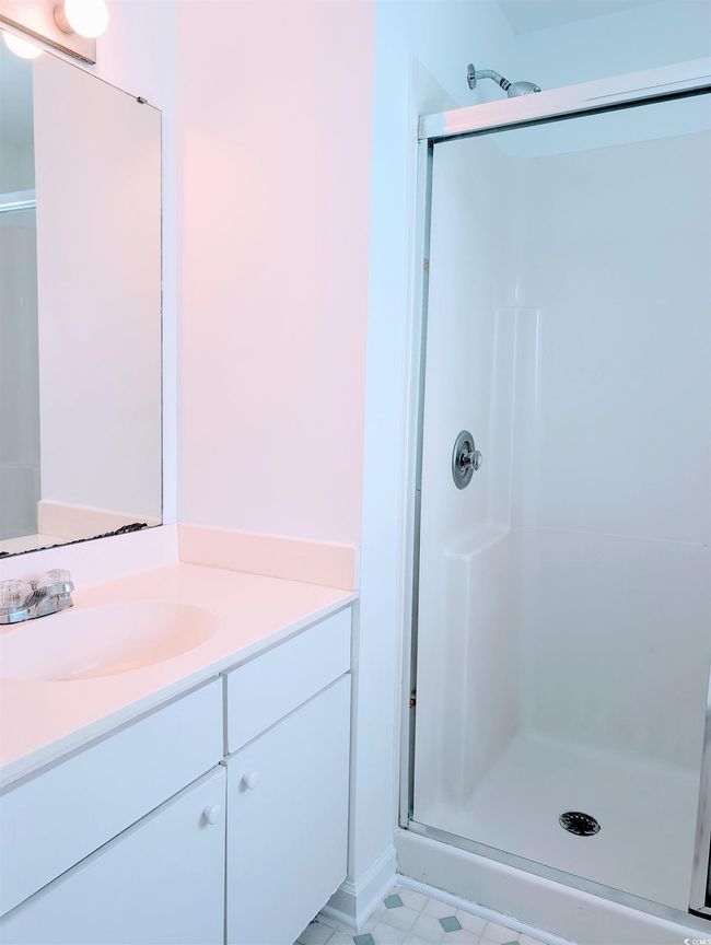 Full bathroom with a shower stall and vanity | Image 12