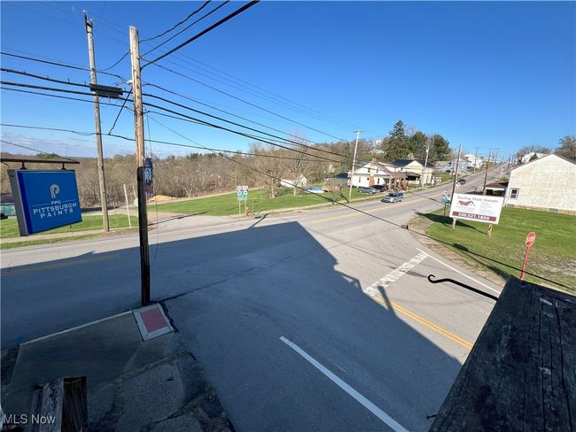 View of street with sidewalks from apartment | Image 33