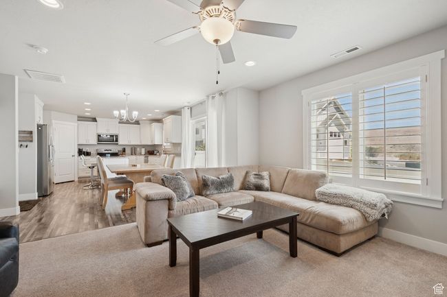 Living area featuring a chandelier, recessed lighting, and ceiling fan | Image 5
