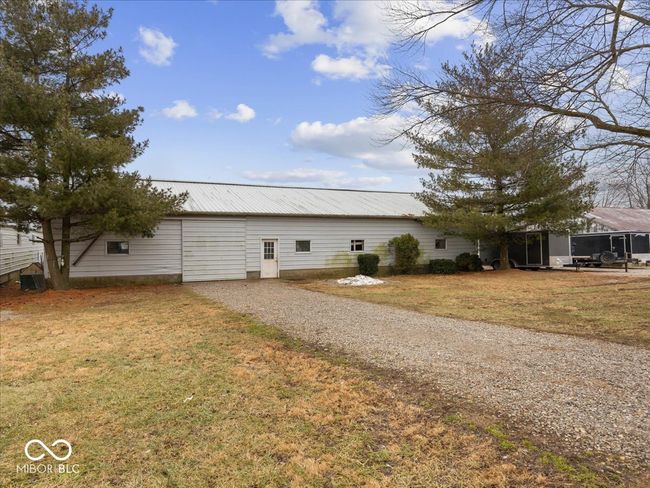 3rd barn with concrete flooring has a heated room and ample space for equipment storage. | Image 66