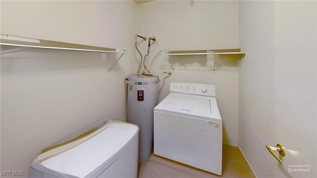 Laundry area with electric water heater, washing machine and clothes dryer, and laundry area | Image 9