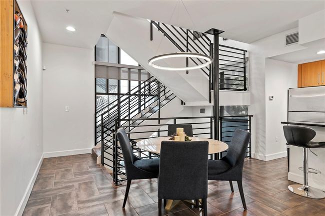 DINING AREA WITH CONTEMPORARY LIGHTING FIXTURE | Image 26