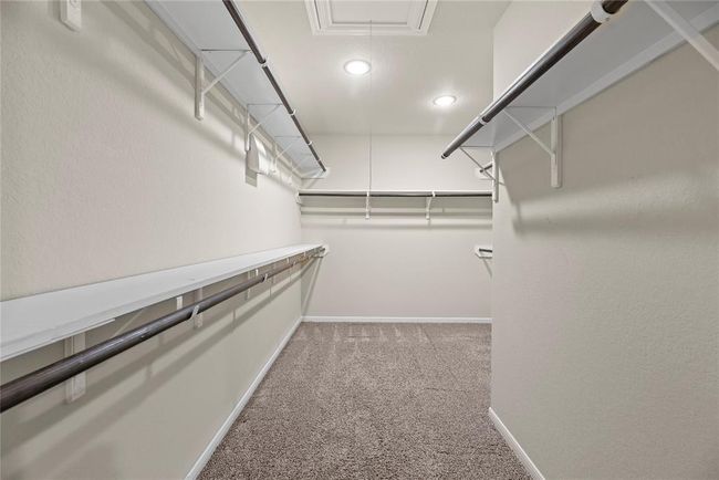 The primary closet offers ample space to store all your clothes and keep everything organized. | Image 16