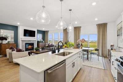 Photo is of the actual model. The kitchen island overlooks the Great Room and dining area. | Image 3