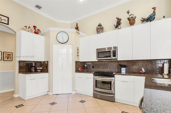 3848 Oak Ridge Cir, House other with 4 bedrooms, 3 bathrooms and null parking in Weston FL | Image 31