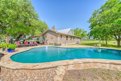 In ground gunite pool surrounded by Oklahoma Stone | Image 1