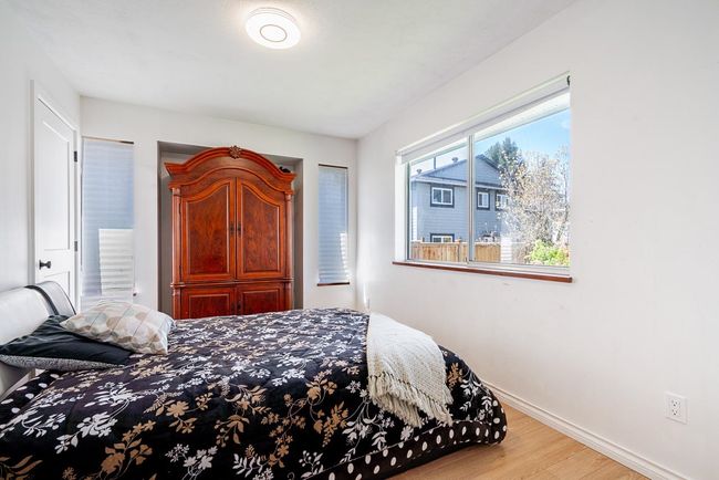 Bedroom with baseboards and light wood-type flooring | Image 17