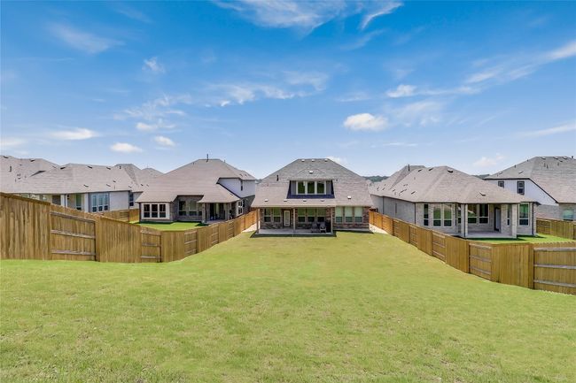 Rear view of property with a residential view and a sunroom | Image 35