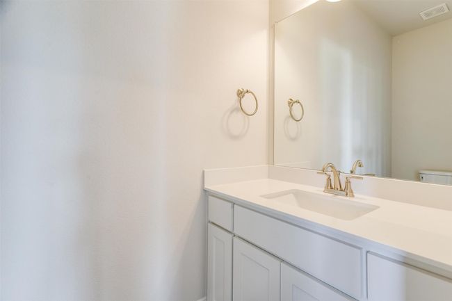 Bathroom featuring vanity and toilet | Image 32