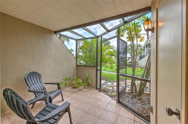 Downstairs screened-in patio | Image 10