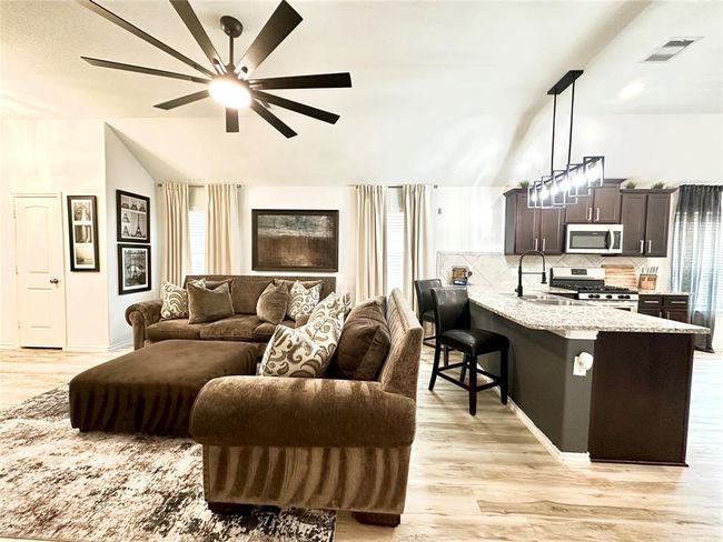 View of living space from hallway that leads to additional bedrooms. | Image 17