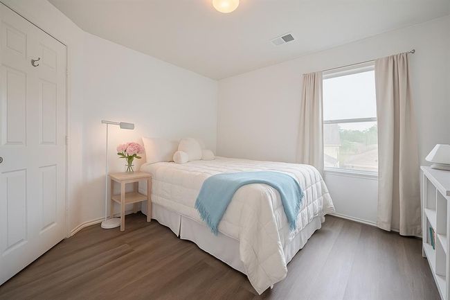 Secondary bedroom upstairs over looking the back yard. | Image 18