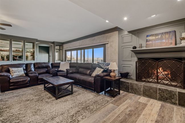 Living room with cozy fireplace | Image 7