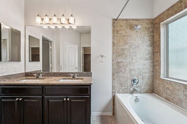 Bathroom featuring healthy amount of natural light and double vanity | Image 23