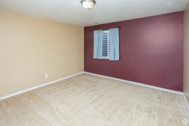 Spare room with carpet floors and baseboards | Image 23