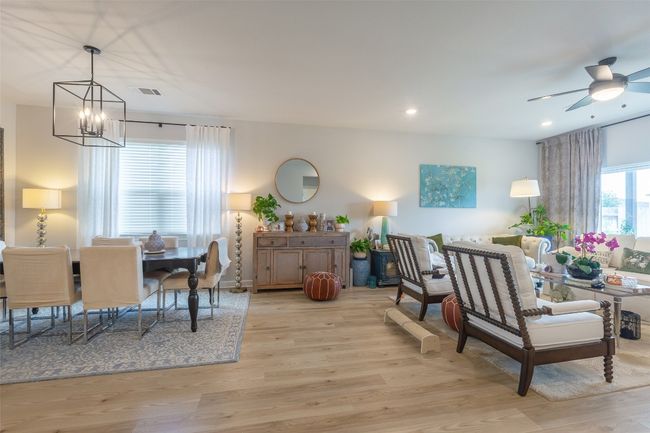 Dining space featuring a chandelier, recessed lighting, light wood-style floors, and a ceiling fan | Image 7
