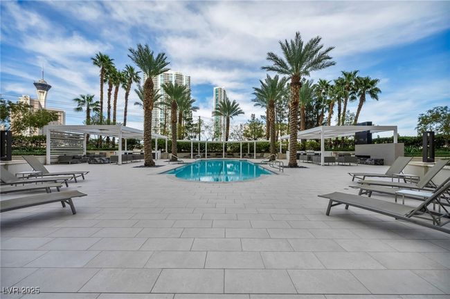 Pool with a pergola and a patio area | Image 66