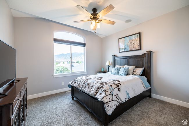 Bedroom featuring carpet flooring, a ceiling fan, and a mountain view | Image 57
