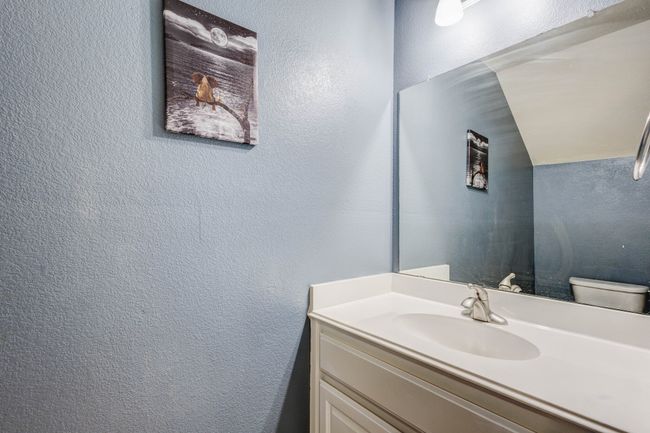 Bathroom featuring toilet and vanity | Image 27