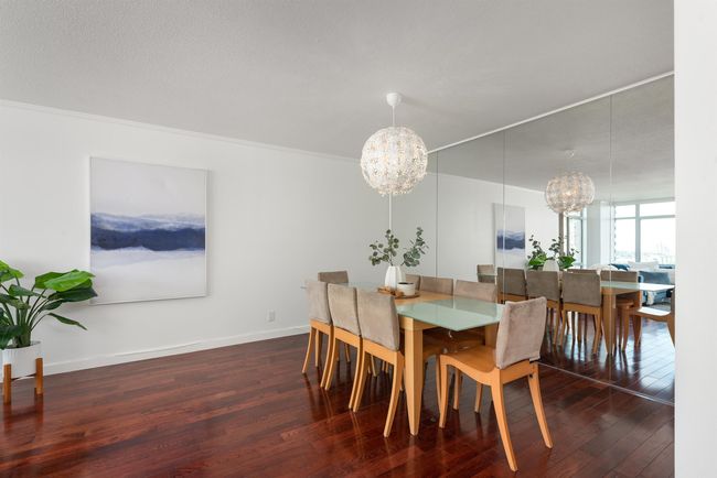 Dining room featuring a chandelier, hardwood / wood-style flooring, and ornamental molding | Image 17