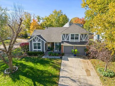 View of front of home with a garage and a front lawn | Image 3