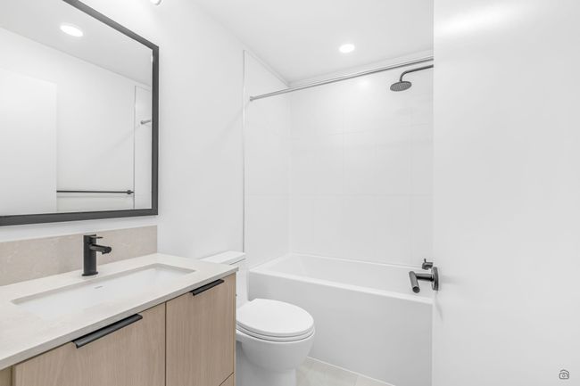 Bathroom with tub / shower combination, toilet, recessed lighting, and vanity | Image 16