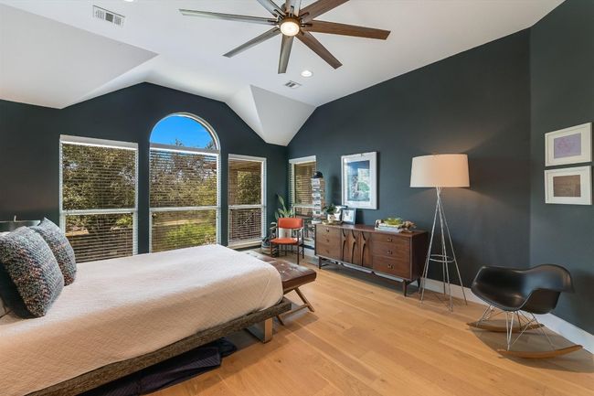 Bedroom with light wood-style flooring, baseboards, vaulted ceiling, a ceiling fan, and recessed lighting | Image 15