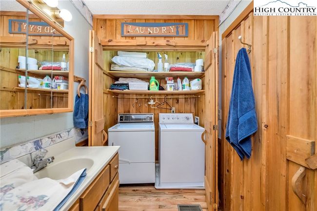 Laundry is discreetly tucked away in the primary bath for convenience. | Image 15