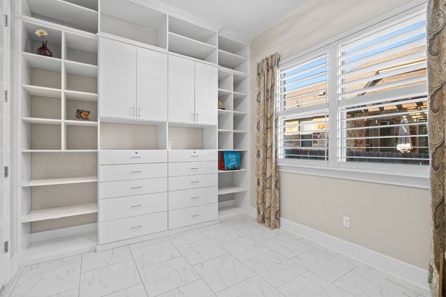 Every element in this space—from the custom cabinetry to the ambient lighting—has been curated for relaxation, making it the perfect extension of the primary suite. | Image 22