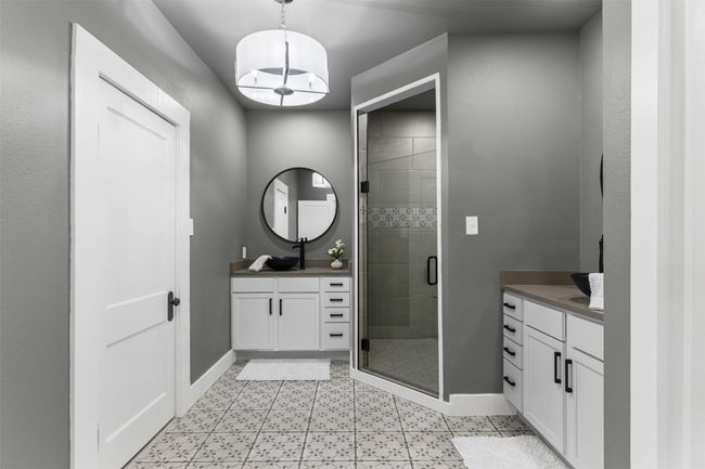 Full bathroom with vanity, baseboards, and a stall shower | Image 26