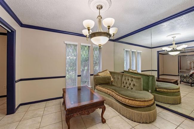 Beautiful chair rail and crown molding accent the formal dining room. | Image 7