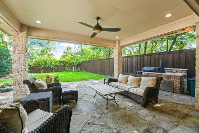 View of patio / terrace with an outdoor hangout area and a ceiling fan | Image 29