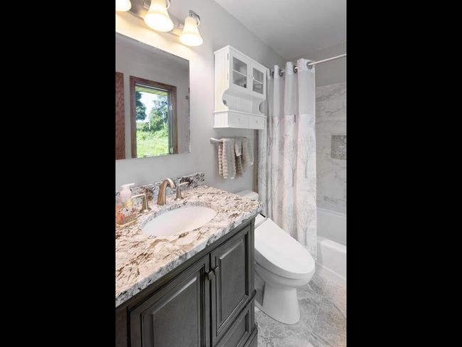 Private, full primary Bath. Granite vanity and heated floors | Image 30