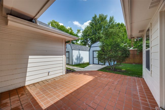 View of patio featuring a storage shed | Image 33